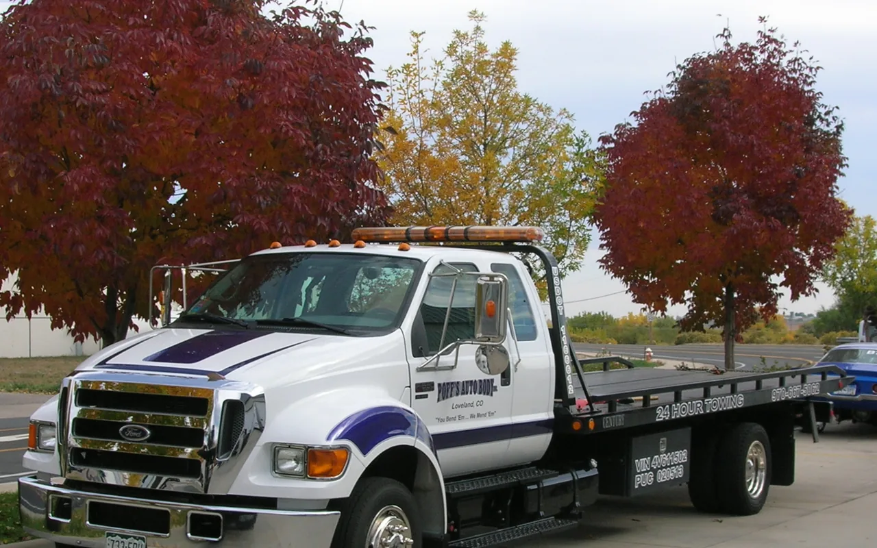 Tow truck operator securing a vehicle in El Paso, Texas